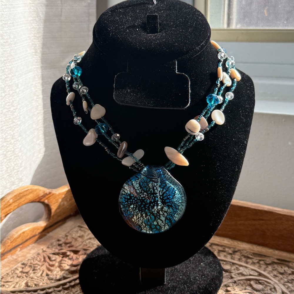 Gorgeous glass pendant with abalone shells